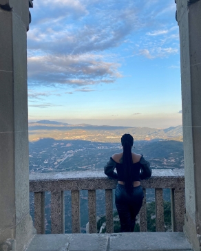 Najauna White looks out over a balcony in Barcelona, Spain