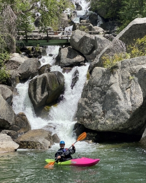 Pat Attkisson on a kayak in front of a waterfall in Idaho
