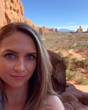 Kelby Miller in an arid landscape with red rocks and buttes