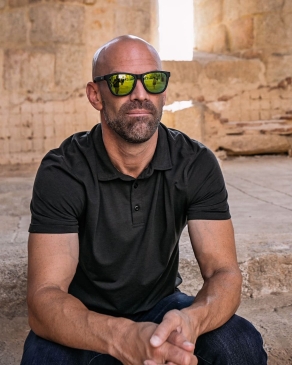 Jay Salyers sitting with sunglasses 