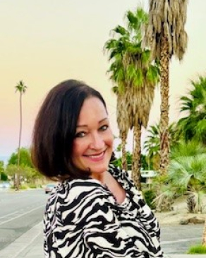Demetria near palm trees