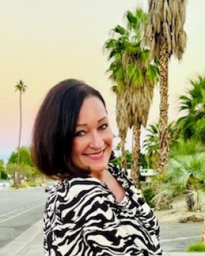 Demetria near palm trees