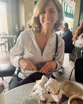 Julie Armstrong smiling at a table