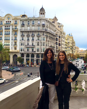 Julie Armstrong and her daughter standing on a patio