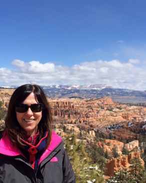 Julie Armstrong standing over a canyon