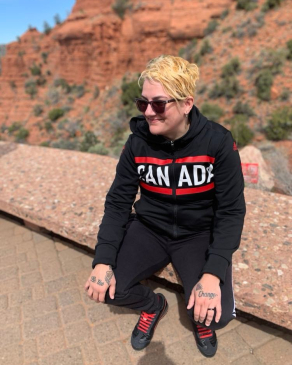 A photo of Lori behind a canyon