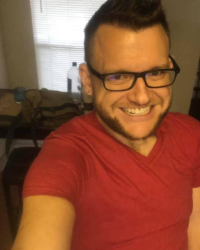 A selfie of Jason wearing a red shirt