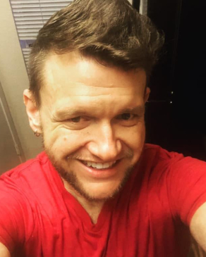 A selfie of Jason wearing a red shirt