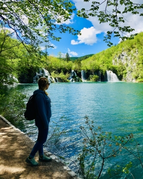 A photo of Anna overlooking a lake while visiting Croatia. 