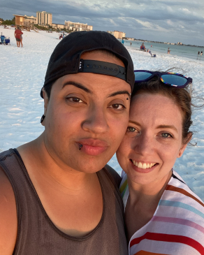 A photo of Jesi and her partner at the beach in St. Pete. 