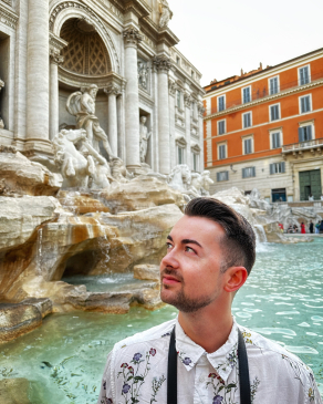 A photo of Joe near a fountain in Rome. 