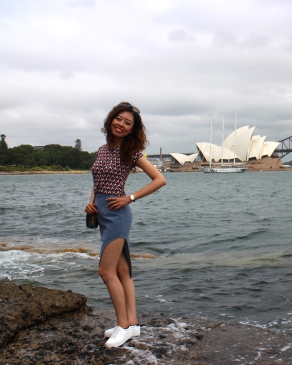 A photo of Wenjie in Sydney with the Opera house as a backdrop. 