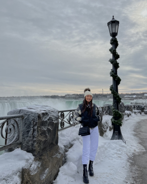 A photo of Tenzin in front of Niagara Falls, Canada