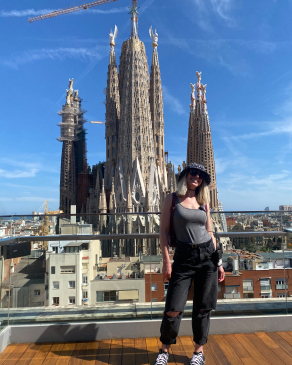 A photo of Christie behind a Spanish monument. 