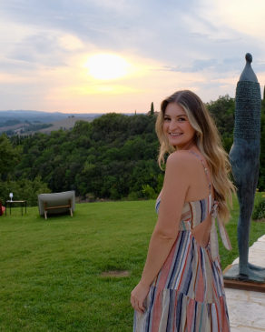 A photo of Taylor overlooking the Italian countryside. 