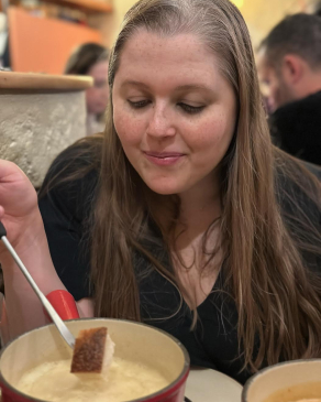 A photo of Angela eating soup in Switzerland. 