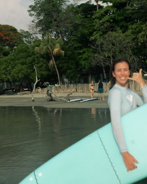 A photo of Shiann getting ready to surf. 