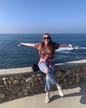 A photo of Andi near the ocean in San Diego. 
