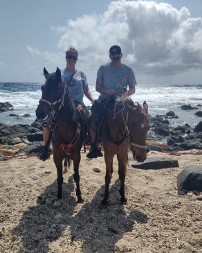 A photo of Kathy on horseback in Aruba. 