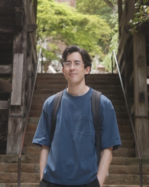 A photo of James behind stairs in Kyoto. 