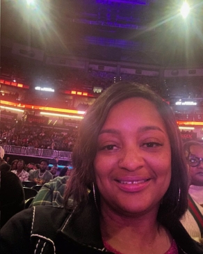 A photo of Jennifer in a sporting arena in Texas. 