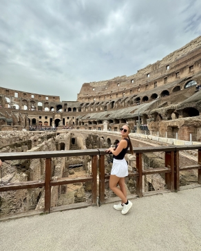 A photo of Jada overlooking the coliseum in Rome.  