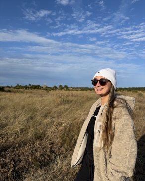 A photo of Jada overlooking a grassy field. 
