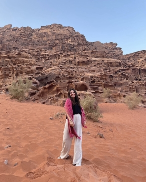 A photo of Maya in a desert in Jordan. 