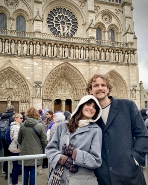 A photo of Kylie in front of a historical building. 