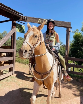 A photo of Kylie on horseback. 