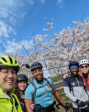 A photo of David and friends biking during cherry blossom season in D.C.