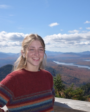 A photo of Layne with a scenic Lake Placid backdrop. 