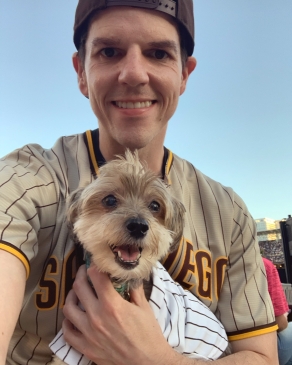 A photo of Michael and his dog at a Padres game. 
