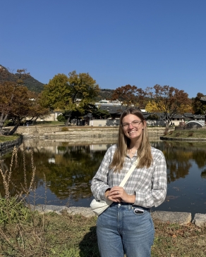 A photo of Emily near a lake in South Korea. 