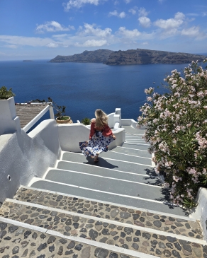 A phot of Kayla walking down steps in Greece. 