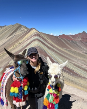 A photo of Micaela and llamas in Peru. 