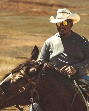 A photo of Bryan on horseback in Wyoming. 