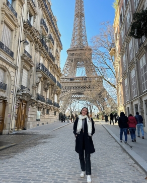 Meg posing near the Eiffel Tower