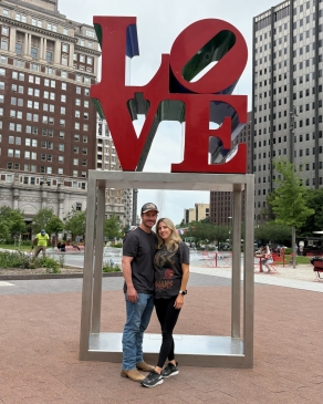Trisha and her partner next to the iconic LOVE statue in Philly. 