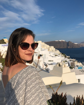 A photo of Rachel looking back at the camera in Greece. 