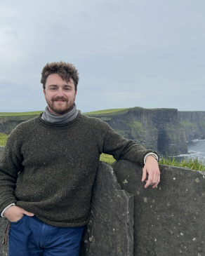 Jack posing near a wall in Ireland. 