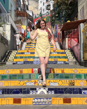 Haylie posing on tiled stairs in Brazil.
