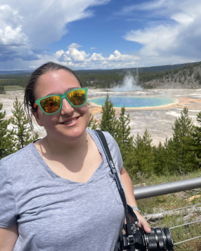 Kim taking a photo while exploring Yellowstone. 