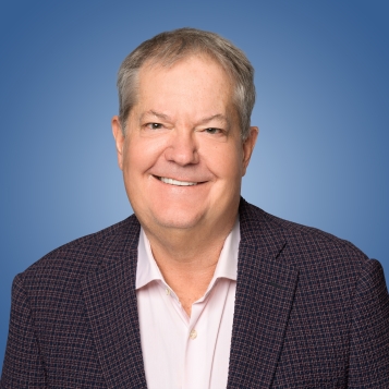 A headshot of DT Minich