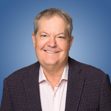 A headshot of DT Minich